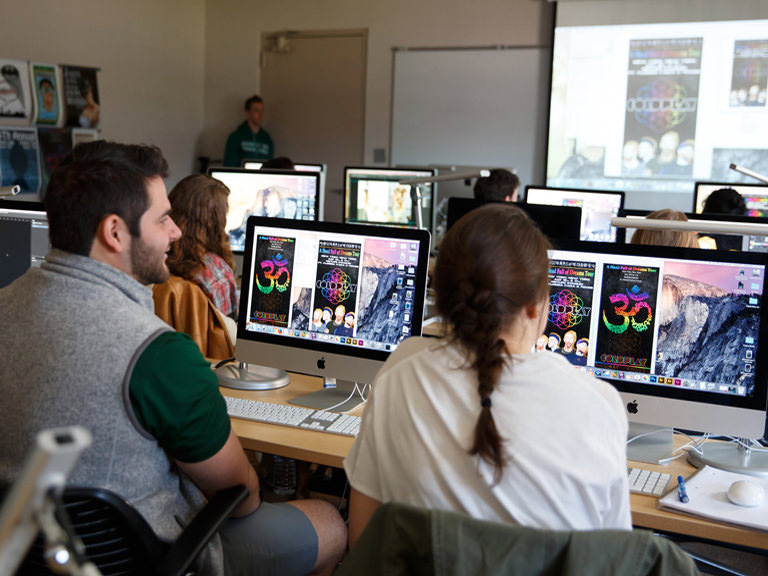 Students learn graphic design in the lab.
