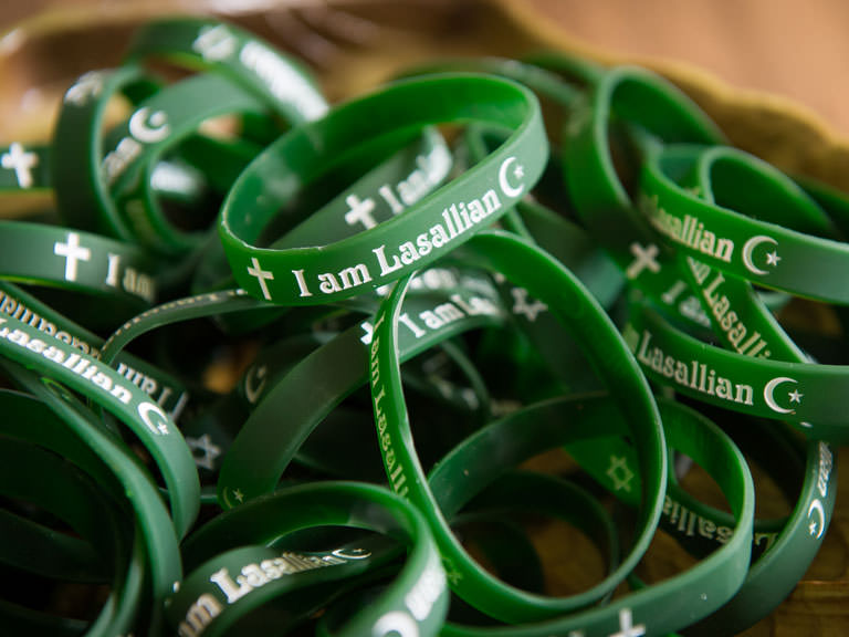 Lasallian wristbands are given out on campus.