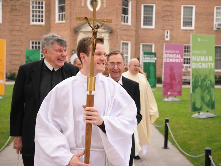 A special processional across the Quad begins Mass at Manhattan College.
