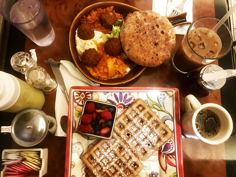 An image of waffles and other food items at Corner Cafe, a restaurant in Riverdale.