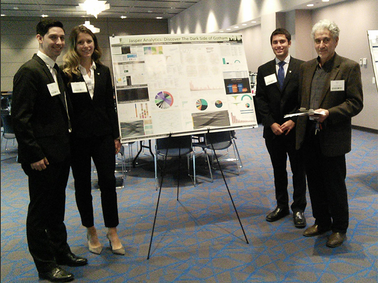 Business analytics group with poster presentation
