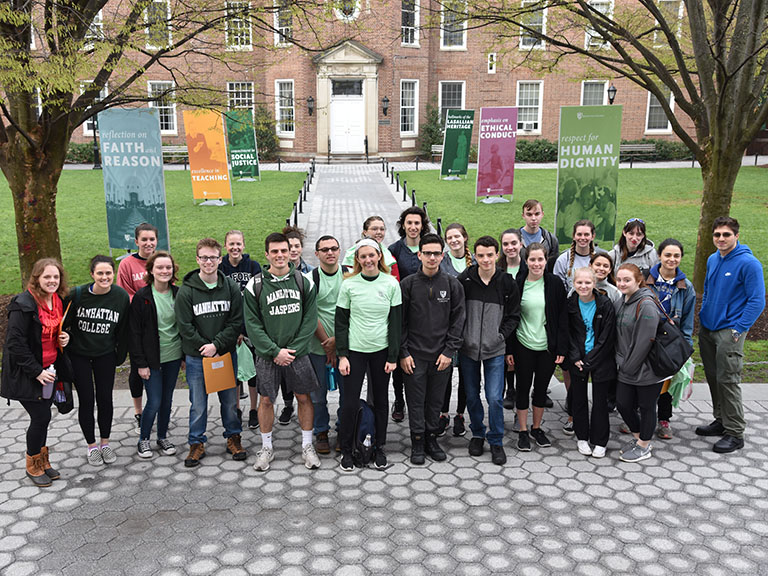 An image of a group of students posing together on campus.