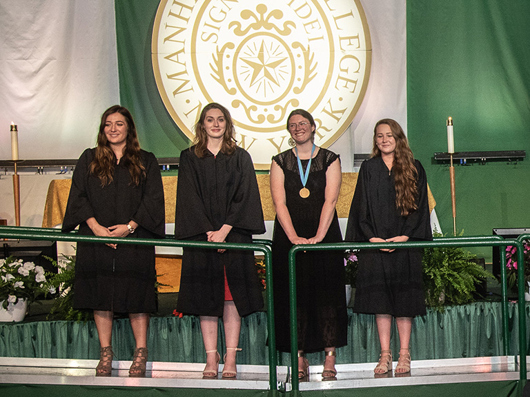 Alannah Boyle, Cameron Gribbons, Melanie O’Connor and Julia Jenkins on stage at 2018 graduation