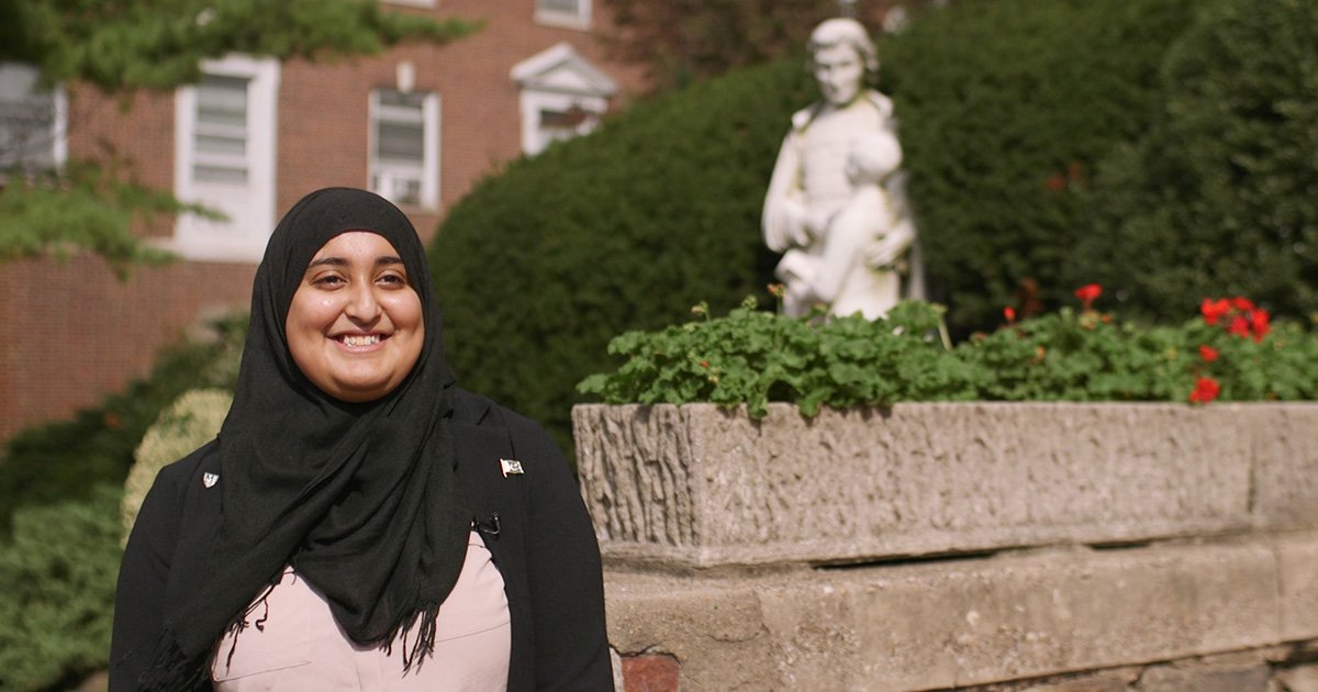 Rabea Ali smiling on campus