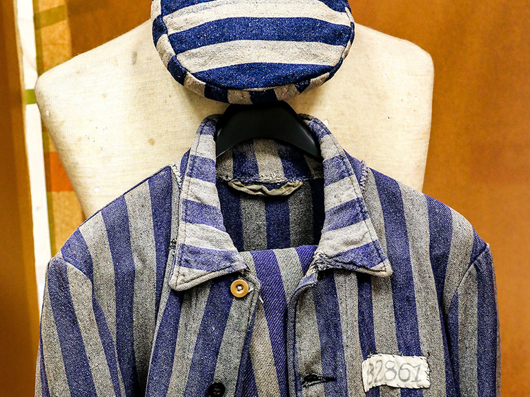 Concentration camp uniform hanging in O'Malley Library