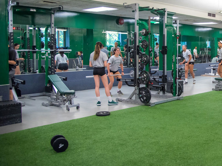 Students strengthen and tone on equipment in the fitness center. 